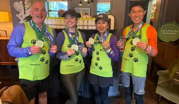 Green image with paw prints showing the IGDB logo and the words Official Event