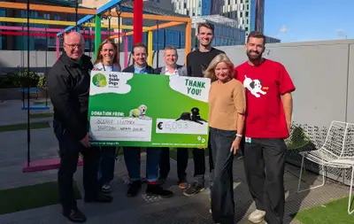 Corinne with IGD staff and Google staff handing over the cheque