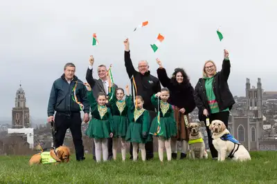 Group photo taken on a hill with the Cork Lord Mayor and 3 dogs